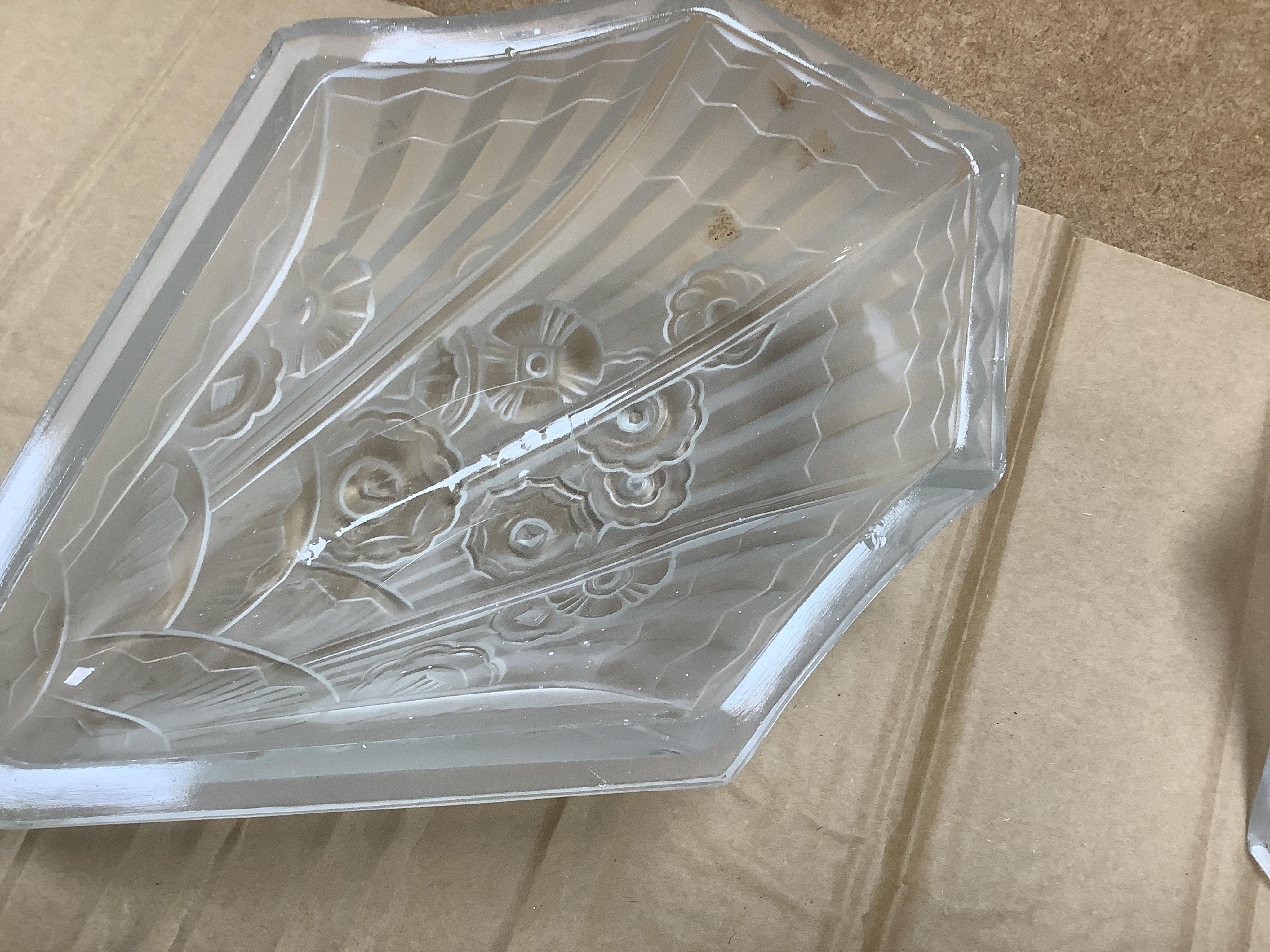 An Art Deco clam shell wall light and a pair of Art Deco wall lights, 30cm high (3). Condition - fair